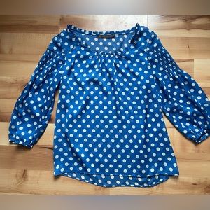Blue and white polka dot blouse
